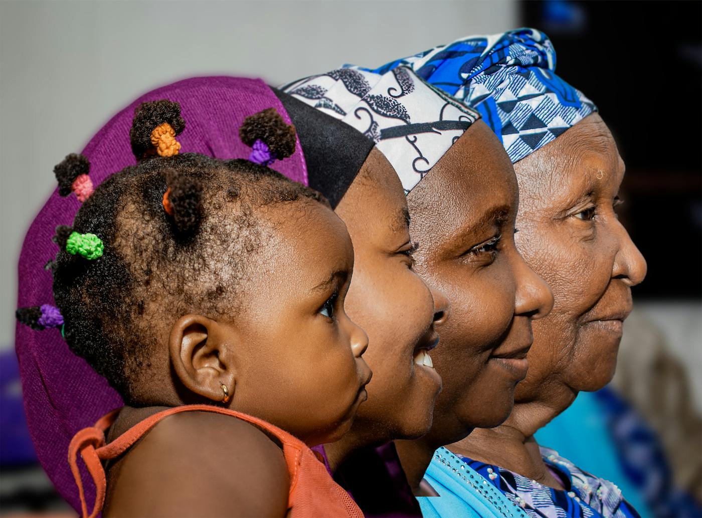 Women of different generations standing together, smiling